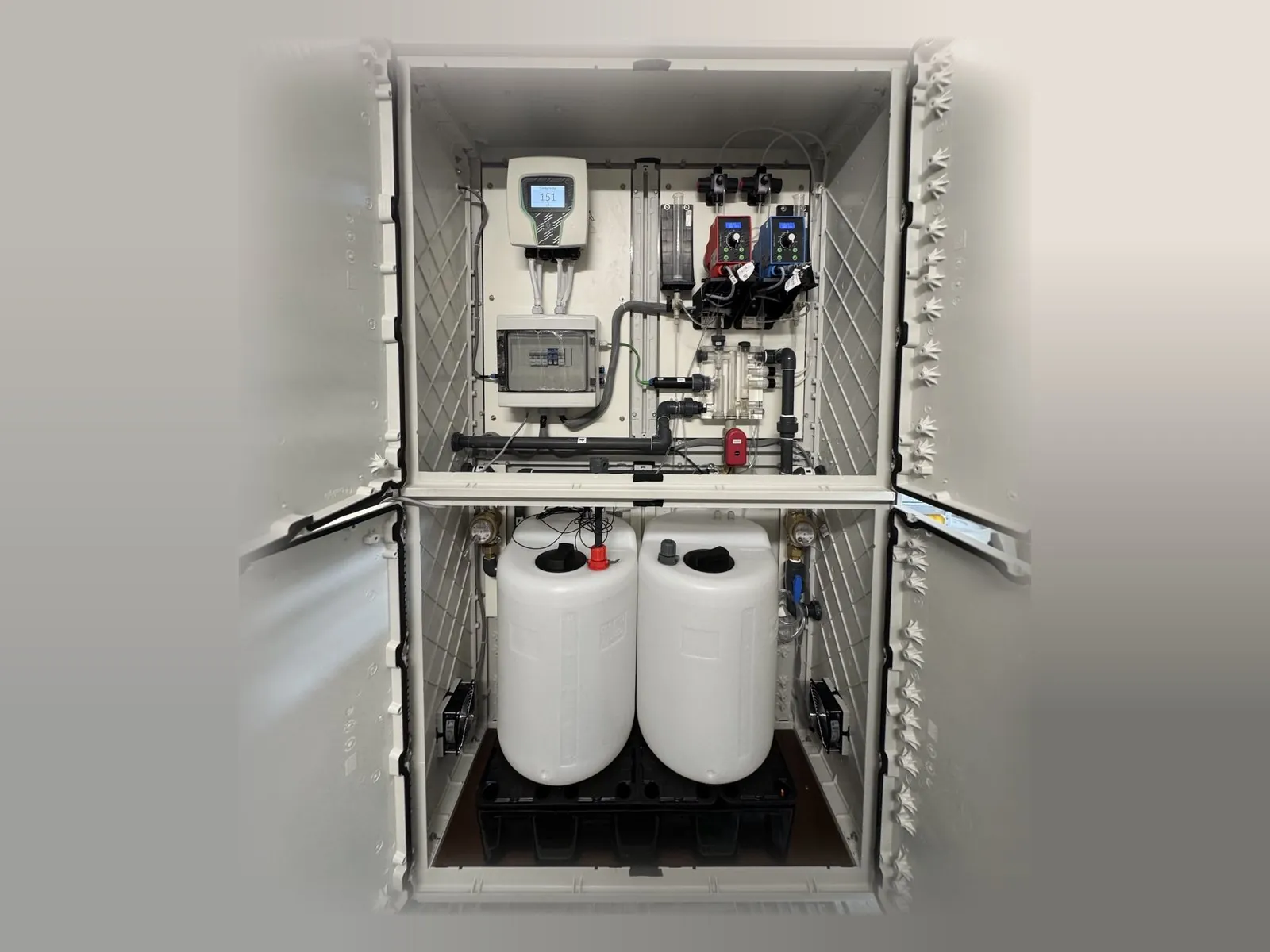 System in a cabinet with panel and chemical tanks