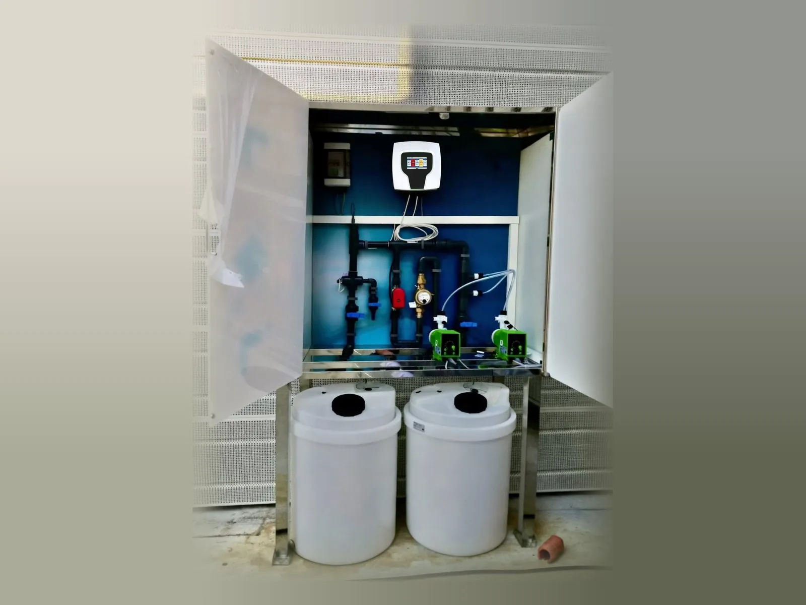 Skid in a box with door, dosing pumps and chemical tanks